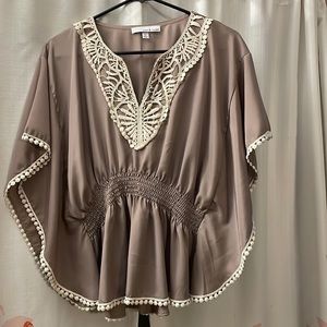 Tan, short sleeve, embroidered, never worn.